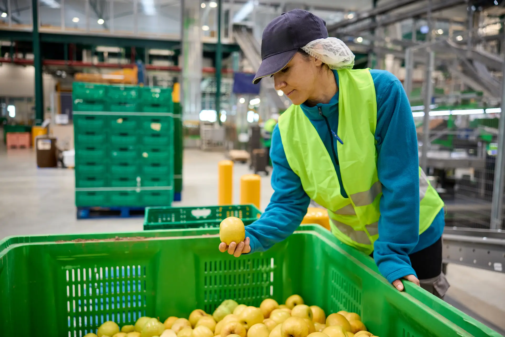 Worker staging packaging materials in crates for an upcoming job